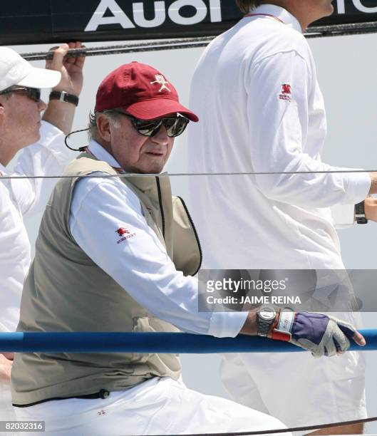 Spain's King Juan Carlos takes part in the first day of racing in the Breitling regatta on board Bribon on July 22, 2008 at Puerto Portals in Palma...