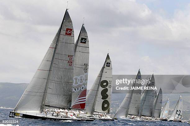Spain's King Juan Carlos takes part in the first day of racing in the Breitling regatta on board Bribon on July 22, 2008 at Puerto Portals in Palma...