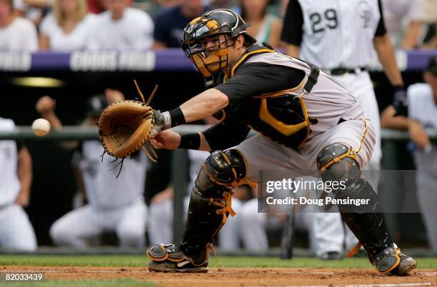 Catcher Ryan Doumit of the Pittsburgh Pirates takes a throw at the plate against the Colorado Rockies at Coors Field on July 19, 2008 in Denver,...