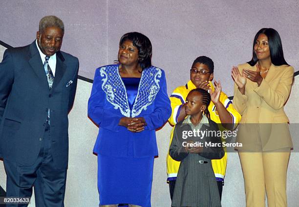 Family members of Los Angeles Lakers Magic Johnson, including wife Cookie , two of his three children and his parents on stage September 27, 2002...