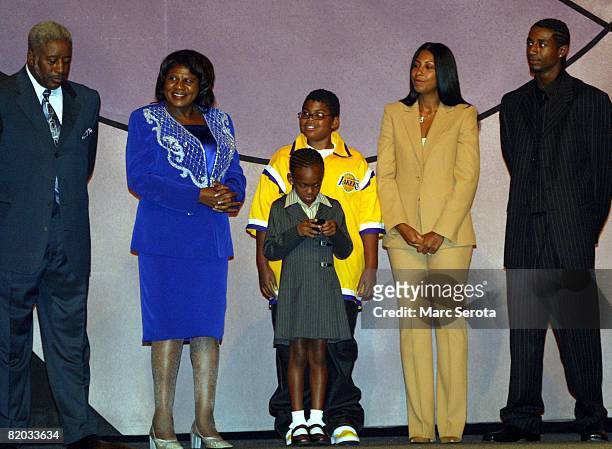 Family members of Los Angeles Lakers Magic Johnson, including wife Cookie , three children and his parents on stage September 27, 2002 during...