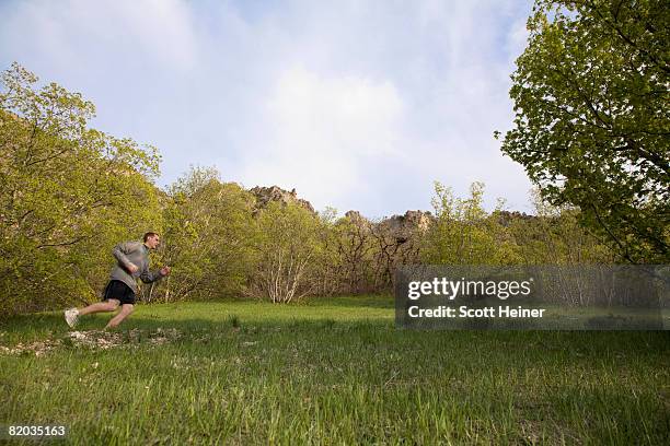 Running In Field 3,697 Man Jogging Field Stock Photos, High-Res Pictures, and Images ...