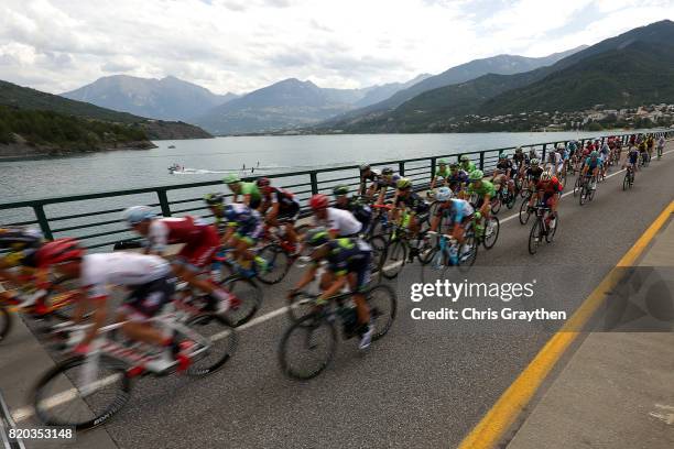 The peloton rides through the countryside during stage 19 of the 2017 Le Tour de France, a 222.5km stage from Embrun to Salon-de-Provence on July 21,...