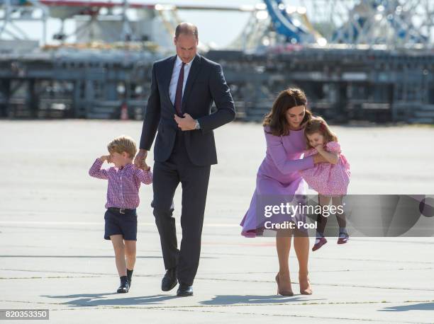 Prince William, Duke of Cambridge, Prince George of Cambridge, Princess Charlotte of Cambridge and Catherine, Duchess of Cambridge depart from...