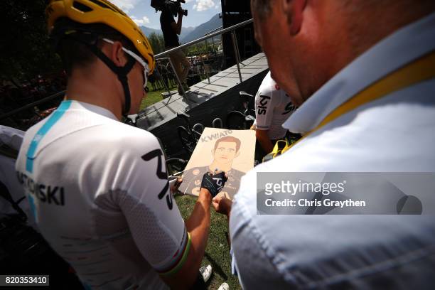 Michal Kwiatkowski of Poland riding for Team Sky signs a poster during stage 19 of the 2017 Le Tour de France, a 222.5km stage from Embrun to...