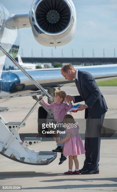 Prince William, Duke of Cambridge, Prince George of Cambridge, and Princess Charlotte of Cambridge depart from Hamburg airport on the last day of...