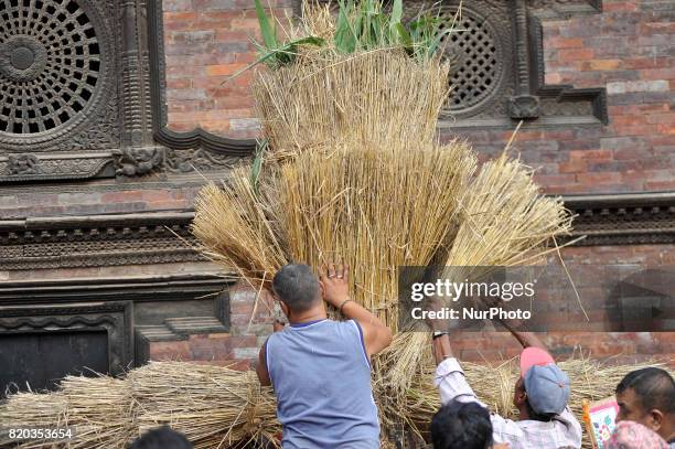 Nepalese devotees making straw effigy demon Ghantakarna during the Gathemangal festival celebrated at Bhaktapur, Nepal on Friday, July 21, 2017....