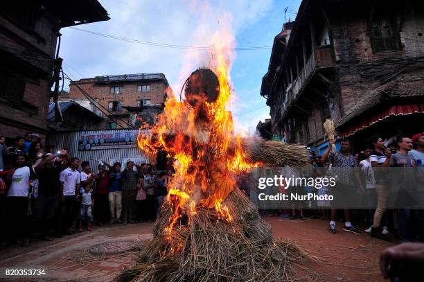 Nepalese devotees celebrate by burning effigy of demon Ghantakarna during the Ghantakarna or Gathemangal festival celebrated at Bhaktapur, Nepal on...