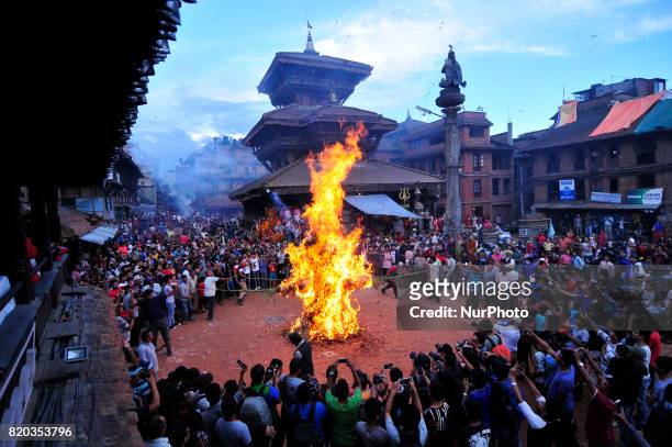 Nepalese devotees celebrate by burning effigy of demon Ghantakarna during the Ghantakarna or Gathemangal festival celebrated at Bhaktapur, Nepal on...