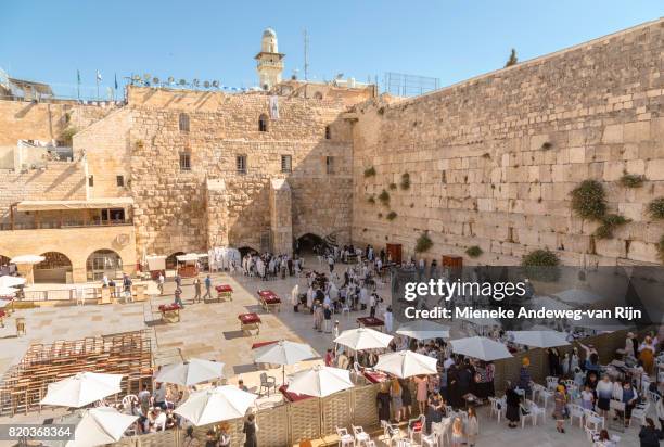 people praying at the wailing wall, at the western wall plaza, in the  the old city of jerusalem, israel. - mieneke andeweg stock pictures, royalty-free photos & images