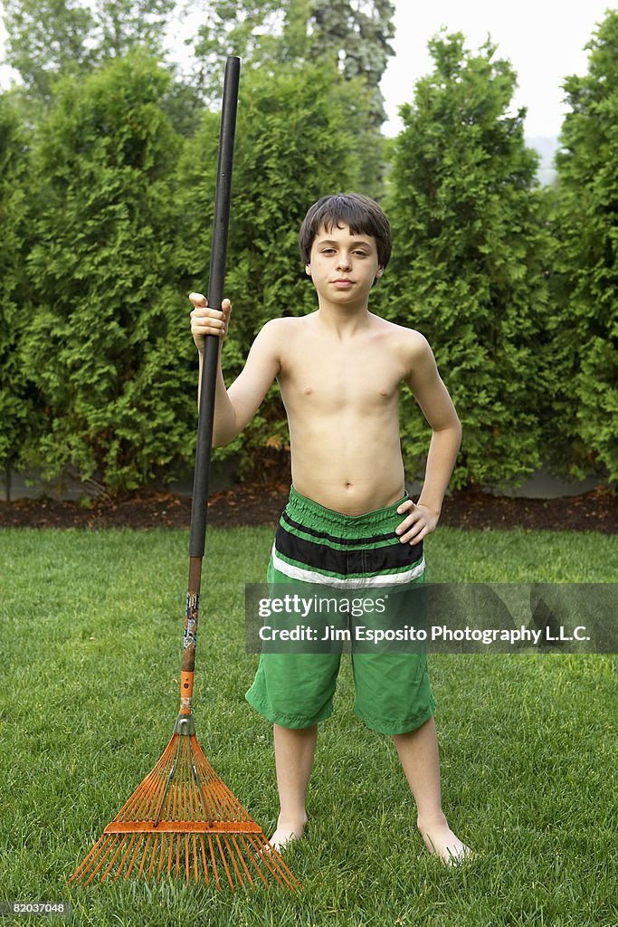Boy With Rake High-Res Stock Photo - Getty Images