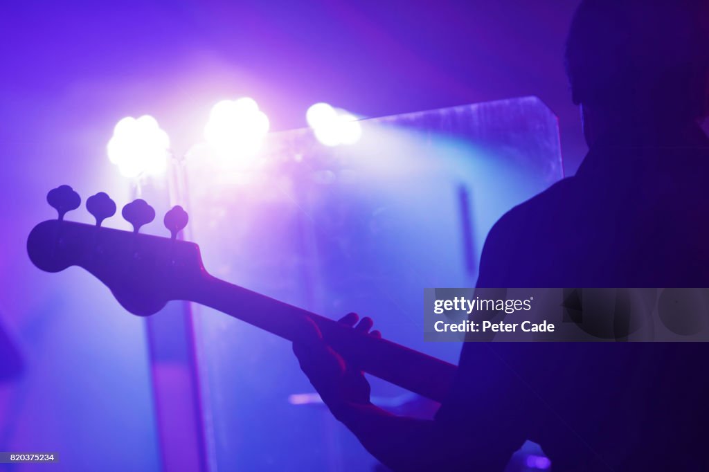 Man playing guitar on stage