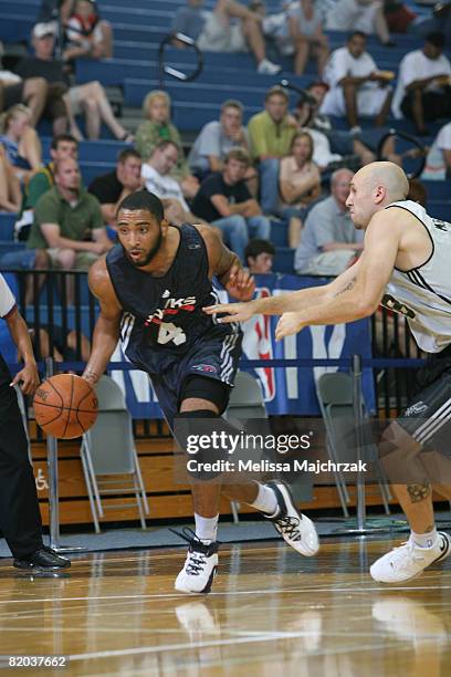 Acie Law IV of the Atlanta Hawks drives past Brian Morrison of the San Antonio Spurs at the Salt Lake Community College Campus on July 22, 2008 in...