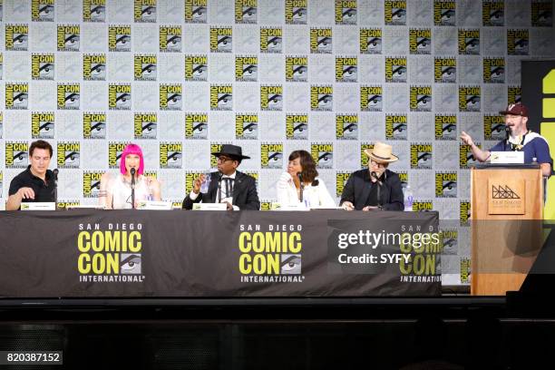 Hosts The Great Debate Panel" -- Pictured: John Barrowman, Charlie Jane Anders, Orlando Jones, Aisha Tyler, Adam Savage, and moderator John Hodgman --