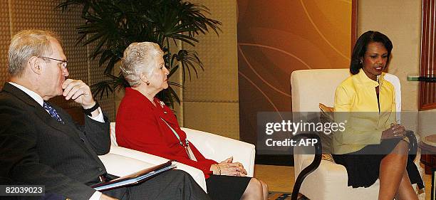 Secretary of State Condoleezza Rice sits with chief US negotiator Christopher Hill as they attend a bilateral meeting with Singapore on the sidelines...