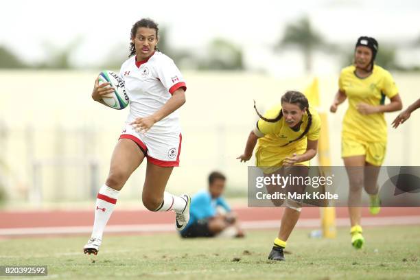 Olivia De Couvreur of Canada makes a break during the girl's rugby 7's gold medal final match between Austra and Canada on day 4 of the 2017 Youth...