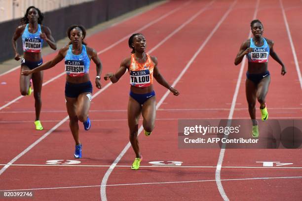 Winner Ivory Coast's Marie-Josee Ta Lou runs second-placed US Kyra Jefferson and third-placed Great Britain's Dina Asher-Smith during the women's...