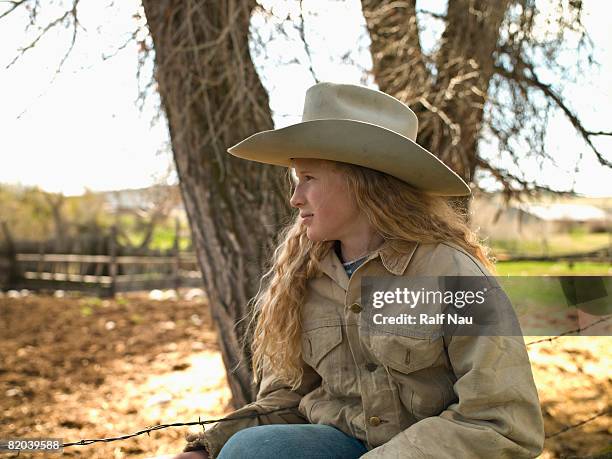 young cowgirl outdoors - girl and blond hair and cowboy hat stock pictures, royalty-free photos & images