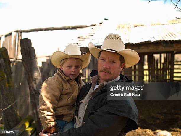 portrait of father and son on family ranch - montana western usa 個照片及圖片檔