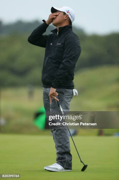 Si Woo Kim of Korea reacts to missing a putt on the 16th hole during the second round of the 146th Open Championship at Royal Birkdale on July 21,...