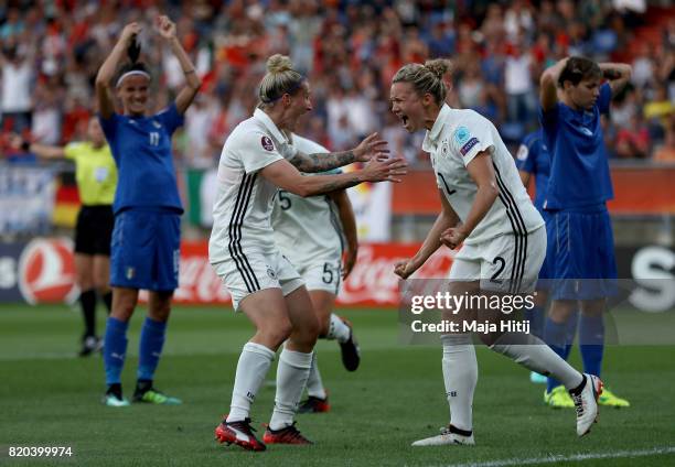 Josephine Henning of Germany celebrate with team mate Anja Mittag after she heads the opening goal during the Group B match between Germany and Italy...