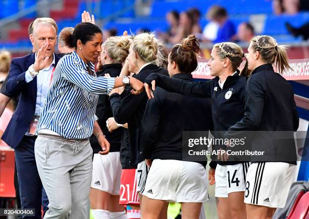 Germany's head coach Steffi Jones celebrates with players after Germany scored during the UEFA Women's Euro 2017 football match between Germany and...