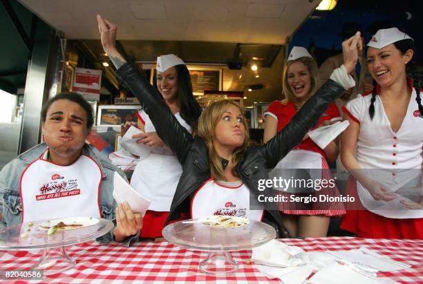 Television presenters Charlotte Dawson celebrates winning a pie eating contest against Kyle Linahan during the Virgin Mobile pie eating competition...