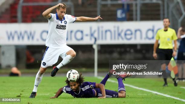 Marc Lorenz of Karlsruher SC challenges Nazim Sangare of VFL Osnabrueck during the 3. Liga match between Karlsruher SC and VfL Osnabrueck at on July...