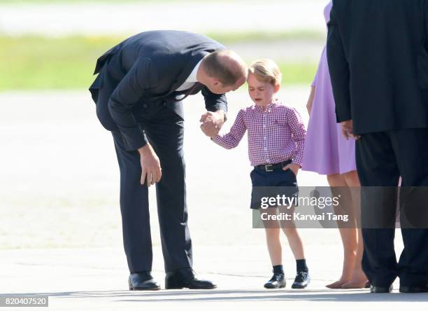 Prince George of Cambridge and Prince William, Duke of Cambridge view helicopter models H145 and H135 before departing from Hamburg airport on the...