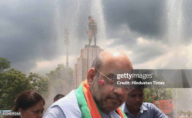 National President Amit Shah pays tribute to Father of the Nation Mahatma Gandhi , while on his way from Sanganer Airport to party office on the...