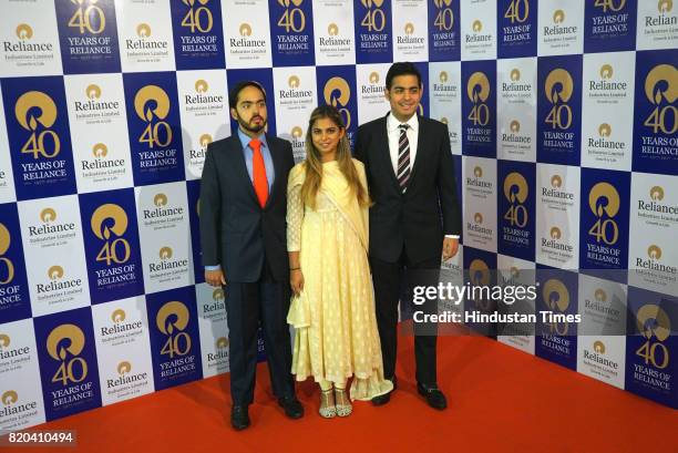 Anant Ambani, Isha Ambani, Aakash Ambani, children of RIL Chairman Mukesh Ambani, pose for a photograph before the 40th AGM of Reliance Industries...