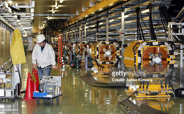 Man works at the 50 Gev Synchrotron facility at Japan Atomic Energy Agency's Japan Proton Accelerator Research Complex on July 23, 2008 in Tokai,...
