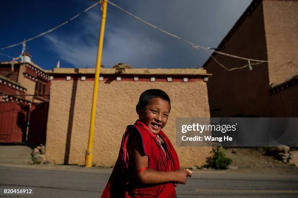 Young Tibetan Buddhist monk in the Long youth Cole Temple on July 21 ,2017 in Litang County, Ganzi Tibetan Autonomous Prefecture, Sichuan Province,...