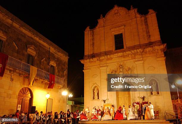 Actors perform in the baroque central square of Giurdignano on August 14 in Salento, Italy. Salento is that strip of land that forms the heel of the...