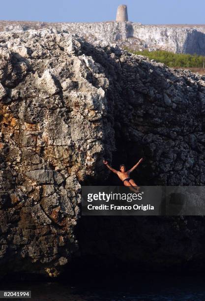 Boy dives in Porto Badisco Bay on August 10 in Salento, Italy. Salento is that strip of land that forms the heel of the boot . It is located between...