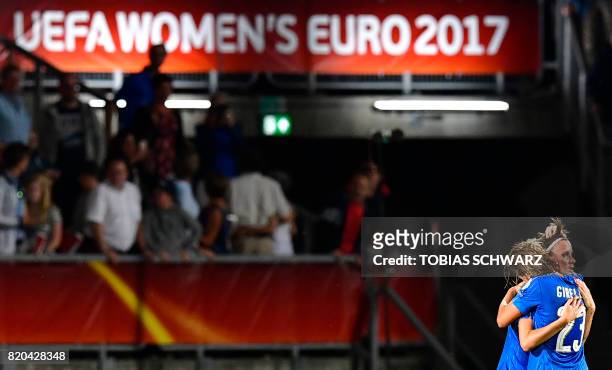 Italy's team players react at the end of the UEFA Women's Euro 2017 football tournament between Germany and Italy at Stadium Koning Willem II in...