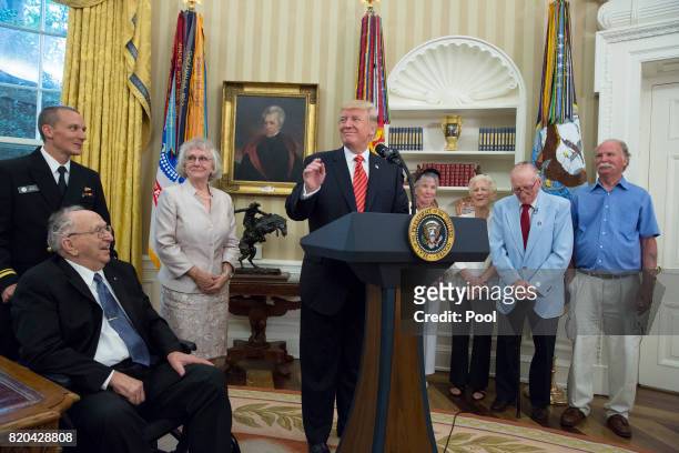 President Donald J. Trump speaks as USS Arizona survivors Lauren Bruner and Donald Stratton listen while visiting the White House on July 21, 2017 in...