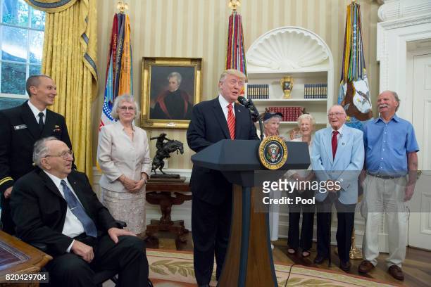 President Donald J. Trump speaks as USS Arizona survivors Lauren Bruner and Donald Stratton listen while visiting the White House on July 21, 2017 in...