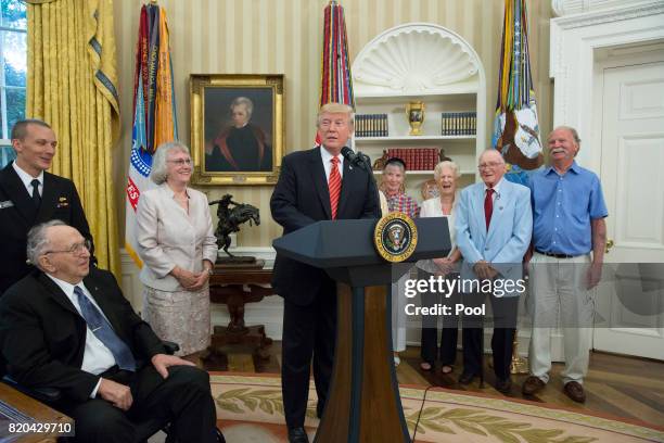 President Donald J. Trump speaks as USS Arizona survivors Lauren Bruner and Donald Stratton listen while visiting the White House on July 21, 2017 in...