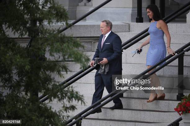 White House Press Secretary Sean Spicer walks out of the Eisenhower Executive Office Building with assistant Vanessa Morrone while returning to the...