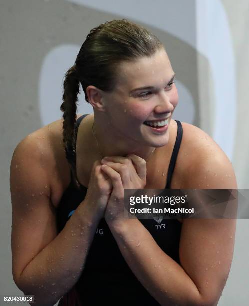 Grace Reid of Great Britain celebrates fourth place in the Women's 3m Springboard at the Duna Arena on day eight of the FINA World Championships on...