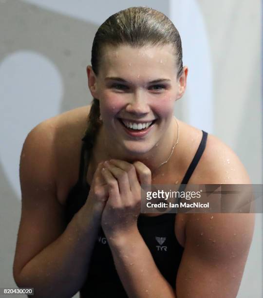 Grace Reid of Great Britain celebrates fourth place in the Women's 3m Springboard at the Duna Arena on day eight of the FINA World Championships on...