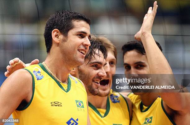 Brazil's players : Dante Guimares, Gilberto Godoy , Andre Heller and Andre Nascimento celebrate their victory over Russia at the end of their...