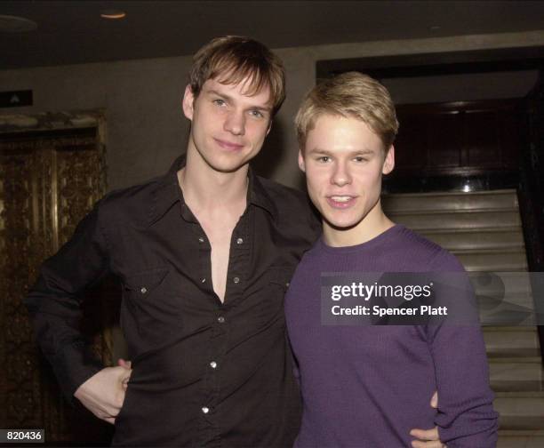 Actors Peter Paige, left, and Randy Harrison pose for photographers during a party for the Showtime television show "Queer As Folk" March 19, 2001 in...