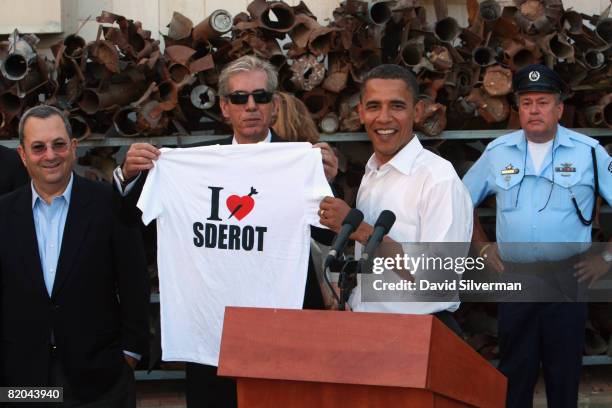 Presumptive Democratic presidential candidate Sen. Barack Obama is presented with an "I Love Sderot" t-shirt by mayor Eli Moyal, as Israeli Defense...