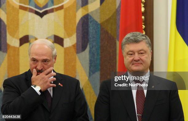 President of the Republic of Belarus Alexander Lukashenko, on the left, and Ukrainian President Petro Poroshenko, on the right, talking during an...