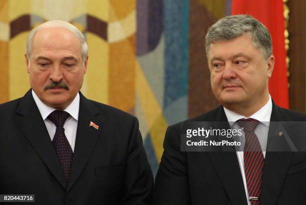 President of the Republic of Belarus Alexander Lukashenko, on the left, and Ukrainian President Petro Poroshenko, on the right, talking during an...
