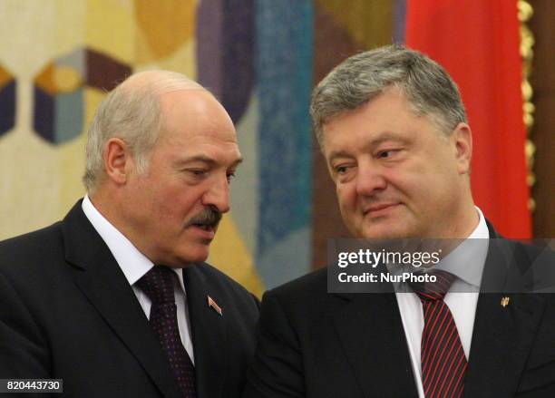 President of the Republic of Belarus Alexander Lukashenko, on the left, and Ukrainian President Petro Poroshenko, on the right, talking during an...