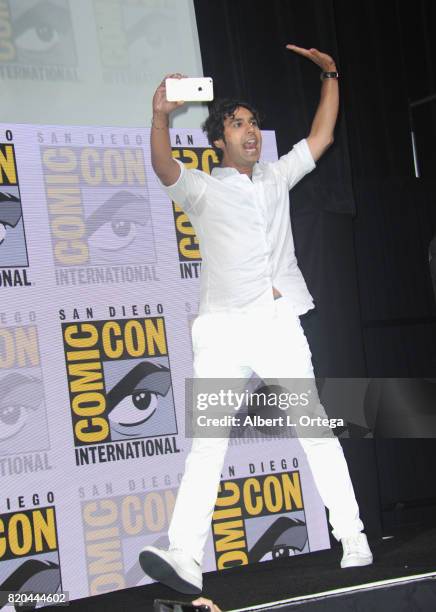 Actor Kunal Nayyar takes a photo as he walks onstage at Comic-Con International 2017 "The Big Bang Theory" panel at San Diego Convention Center on...