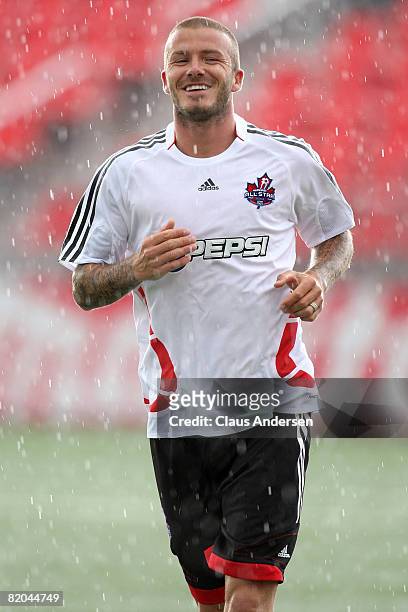 Midfielder David Beckham of L.A. Galaxy jogs during a MLS All Star training session before the MLS All Star Game at BMO Field on July 23, 2008 in...